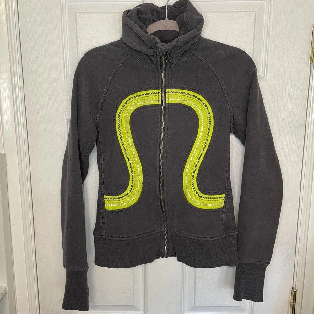 Flat-lay of pre-owned lululemon jackets & outerwear from a ThriftUp wholesale lot